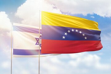 Sunny blue sky and flags of venezuela and israel