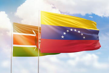 Sunny blue sky and flags of venezuela and kenya