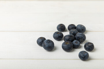 Blueberry. Ripe and fresh blueberries on a white texture background. Vitamins. Healthy food. Juicy berry. Copy space. Place for text