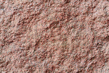 The texture of the stone is light burgundy granite with colored inclusions