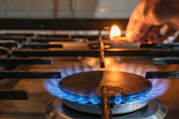 ignite the gas burner on the stove