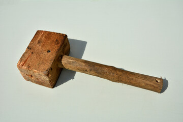 Ancient wooden hammer with woodworm.