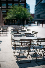Tables and chairs at outdoor restaurant on a sunny day