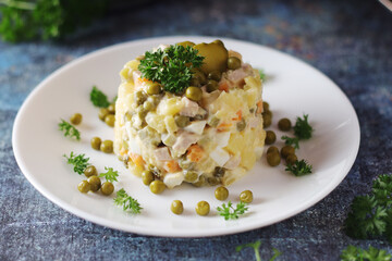 Olivier salad, traditional Russian dish, served on the plate