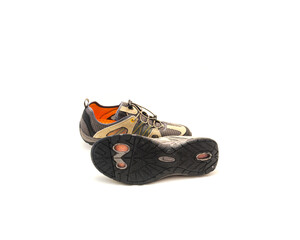 Side view pair of water shoes with sole traction and quick release bungee lace system, drying synthetic leather, mesh uppers isolated in khaki orange on white background
