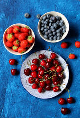 Still life photo with seasonal fruit. Colorful picture of summer fruit on a table. 