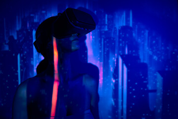 Fototapeta na wymiar metaverse and technology, woman in virtual reality universe with vr glasses headset, futuristic background studio shoots, meta verse and wearable technology