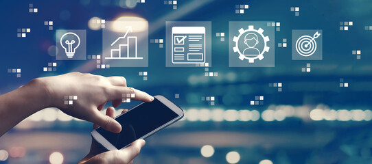 Project management theme with person using a smartphone