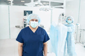 Two medical workers standing in the operation theatre