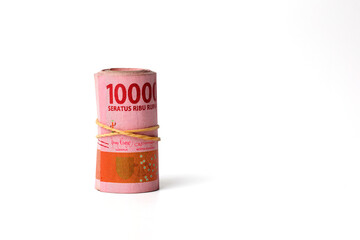 Roll of Indonesian money. Isolated on white background with copyspace