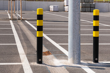Black and yellow bollards in the great parking lot.