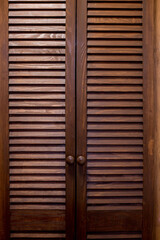 Obraz premium Wooden shutter door, wooden door with natural brown color and texture, background