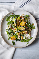 Baby courgette salad on ricotta cheese