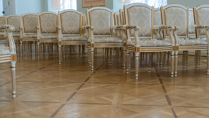 Row of luxury vintage chairs. Chairs for seating the audience at the conference or concert. Theatrical armchairs.