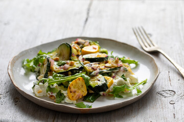 Baby courgette salad on ricotta cheese