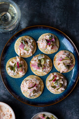 Party canapes, blinis with salmon spread