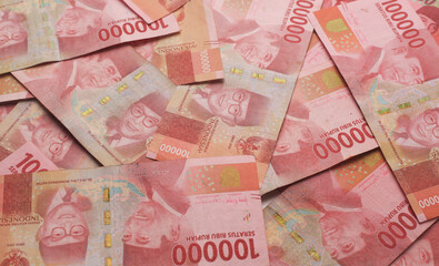Indonesian rupiah cash banknotes money. Money pile 100000 rupiah bills