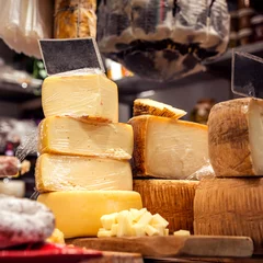 Fotobehang Italian food market with cheese, formaggio crociato fresco, Tuscan delicatessen stall display, Florence, Italy © Johana