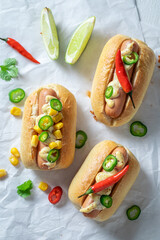 Spicy and delicious mini hot dogs with sausage and sauce.