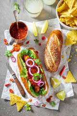 Spicy barbecue hot dogs with grilled sausage and sauce.