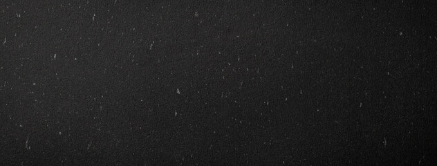 銀箔を散らした黒い紙の背景テクスチャー