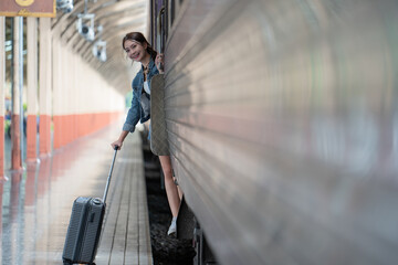 Asian woman going to travel by train