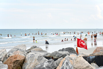 Swimmers and bathers enjoying the refreshing waters of the Atlantic Ocean at Jetty Park in the port...