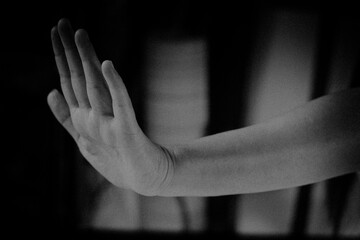 Hands of Asian women are prohibited. In gloomy tones being in denial and expressing restriction.