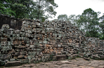 Fototapeta na wymiar A pile of sandstone used to build Bayon Temple that hasn't been restored in Siem Reap, Cambodia