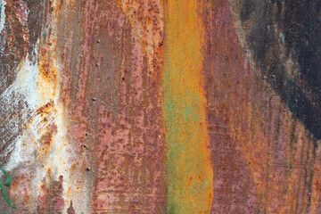 Obraz na płótnie Canvas The texture of rusty metal with streaks of paint