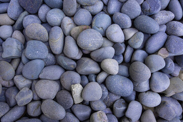 Fototapeta na wymiar Top view of big smooth light blue stones for background and texture. Concept of spa background.