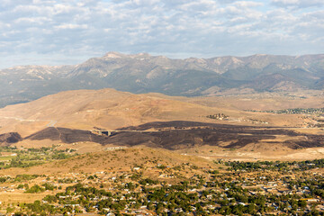 Burn scar from wildfire stretches across the landscape hwy 395 south of Reno, NV