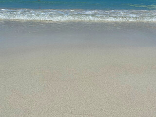 Beautiful calm blue sea and ripple on white sand at the beach