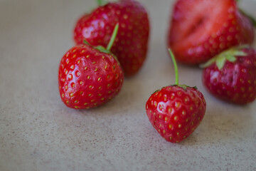 Ripe red strawberries on plate. Summer berries. Sweet strawberry on table. Summer farm harvest. Rustic food. Healthy lifestyle. Juicy berry. 