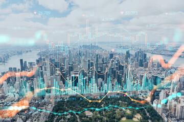 Fototapeta premium Aerial panoramic helicopter city view of Midtown Manhattan neighborhoods and Central Park, New York, USA. Forex graph hologram. The concept of internet trading, brokerage and fundamental analysis