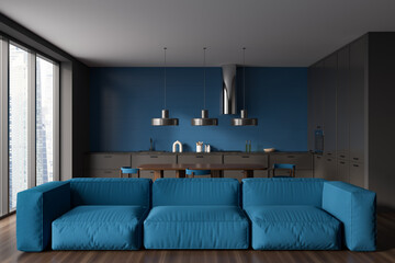 Blue kitchen interior with couch and eating area, panoramic window