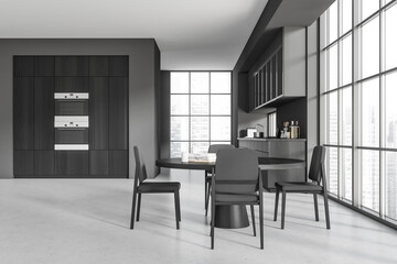 Grey kitchen interior with eating table and seats, appliances and window