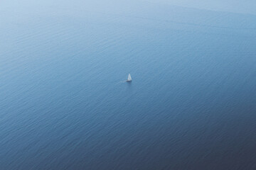 Aerial shot of a boat in Santorini, Greece, Cyclades