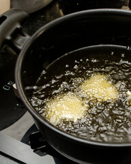 frying dough in oil, for a typical Brazilian recipe called 'bolinho de chuva'