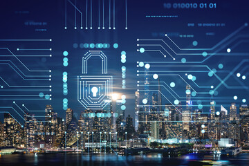 New York City skyline from New Jersey over the Hudson River with the skyscrapers at night, Manhattan, Midtown, USA. The concept of cyber security to protect confidential information, padlock hologram