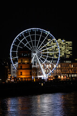 Night view to illuminated ferris wheel
