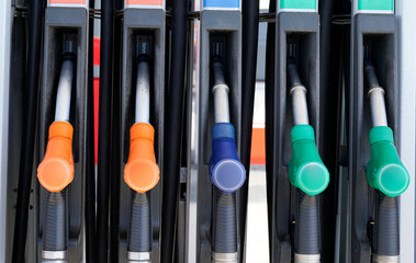 Fuel pumps station close up gasoline dispenser Gas station with colored petrol hoses - obrazy, fototapety, plakaty