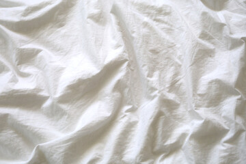 Closeup white bedding background.