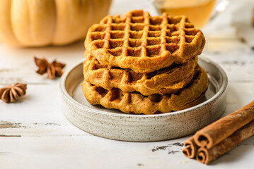 pumpkin waffles on a white wooden background