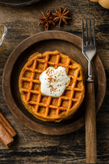 pumpkin waffles on a dark wooden background