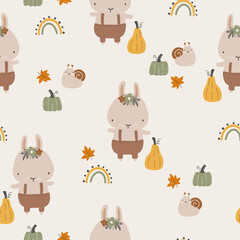 Obraz premium Seamless childish pattern with bunnyes, rainbow and pumpkins. Creative childish urban texture for fabric, wrapping, textile, wallpaper, clothing. Vector illustration.