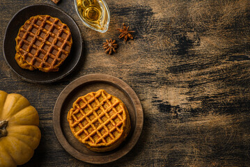 pumpkin waffles on a dark wooden background