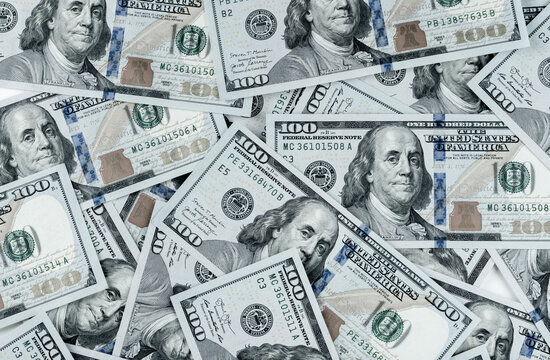 pile of one hundred US banknotes. Cash of hundred dollar bills, dollar background image. 100 bills background