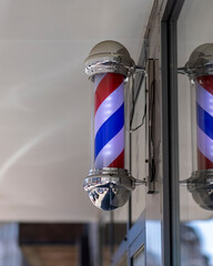 A Barber's Pole in front of barbers shop in Cologne
