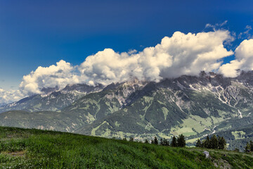 Beautiful summer landscape with dramatic clouds in the sky over impressive mountains - Hochkönig Austria